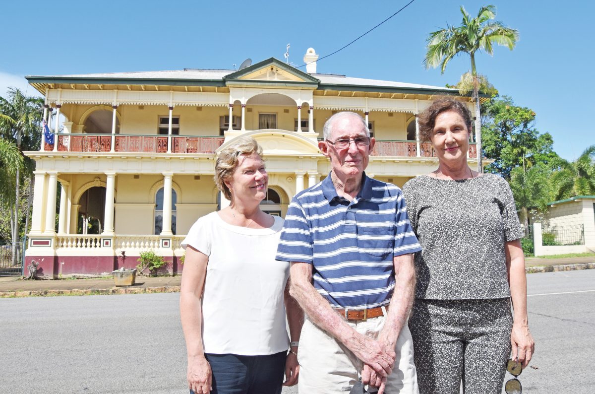 Dick Kellaway, with daughters Julie Wallace and Shaunagh Kellaway, returned to Cooktown 82 years after he left as an 11-year-old during World War II. He is standing in front of his former home, the old Bank of New South Wales building.