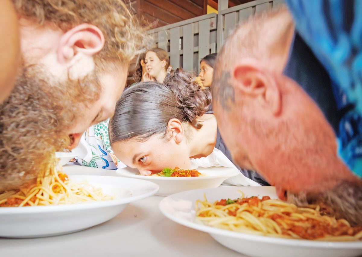 The competition was fierce in the spaghetti eating competition. Pictures: Cook Shire Council/Colyn Huber