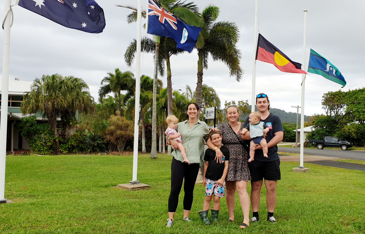 Coreena Morris with niece Bella, Luke and Meg Reeves, Jake Morris and nephew Tommy with flags at halfmast at Cook Shire Council in honour of former chairman Grant Morris.