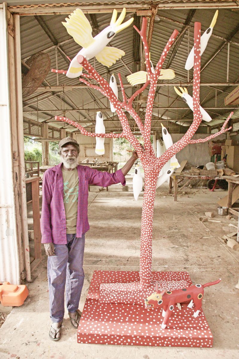 Keith Wikmunea with his award-winning sculpture in Aurukun.
