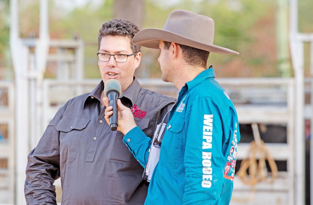 Matt Nicholls speaks with Weipa Rodeo announcer Locky Bensted prior to his bullride.