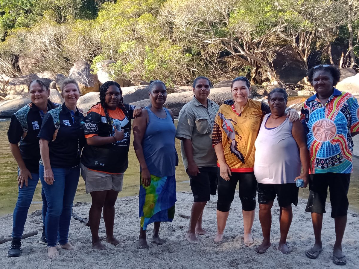 Group photo of Wujal Wujal traditional owners standing on Country.