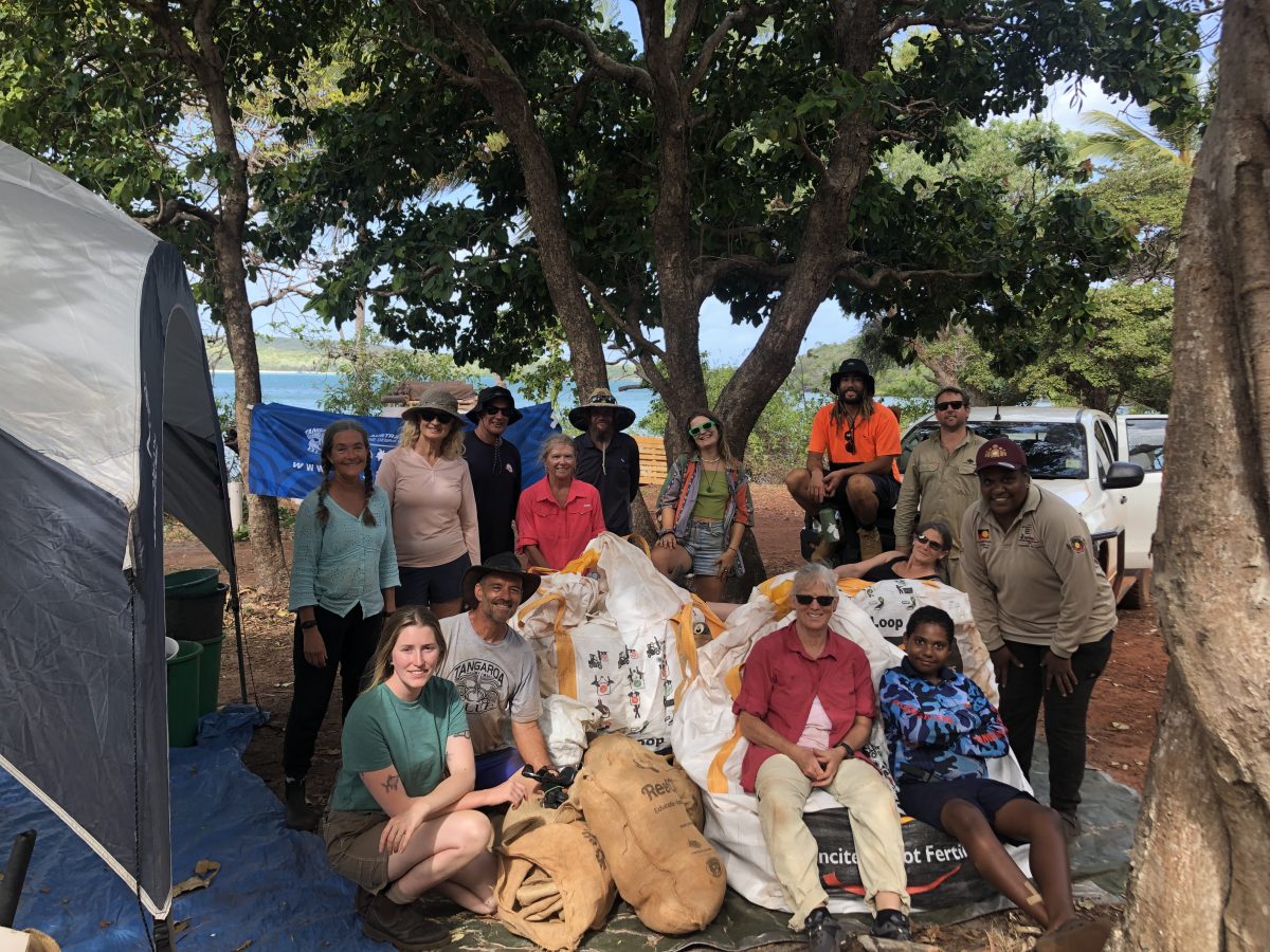 Group photo of Tangaroa Blue volunteers with the bags of rubbish collected.