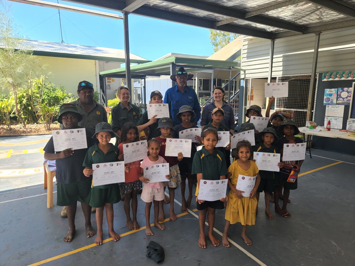 Group photo of the students with local Indigenous rangers.