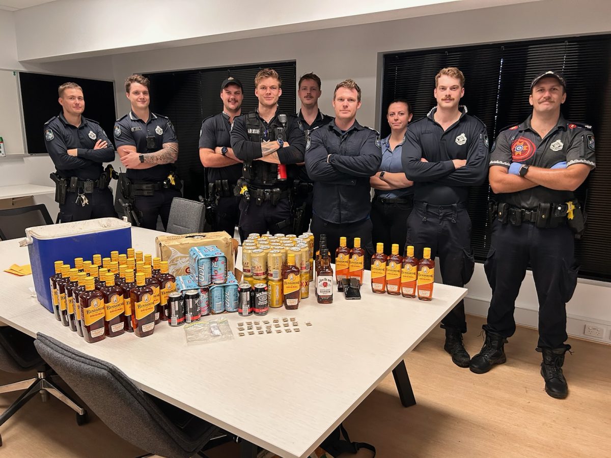 Police with confiscated alcohol