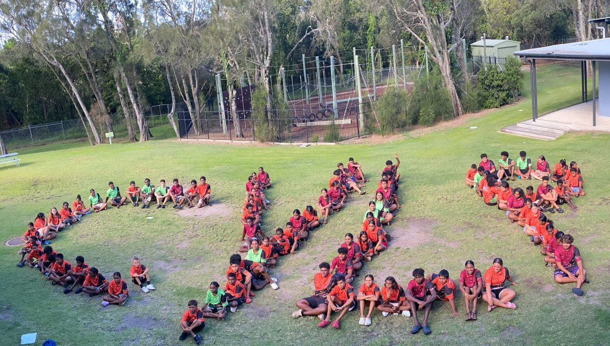 Students sit in formation to spell out CYLP