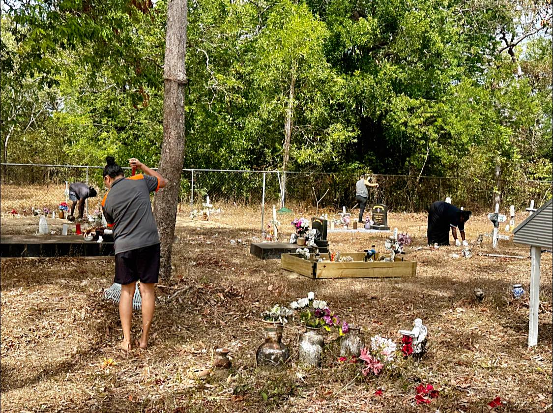 Coen communiy cleaning cemetery