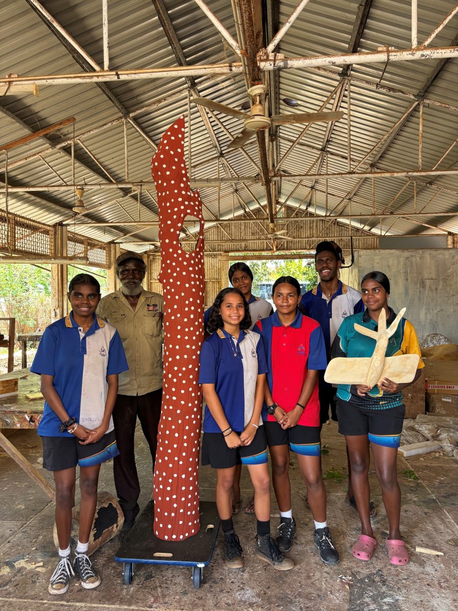 Students look at Uncle Keith's tree sculpture