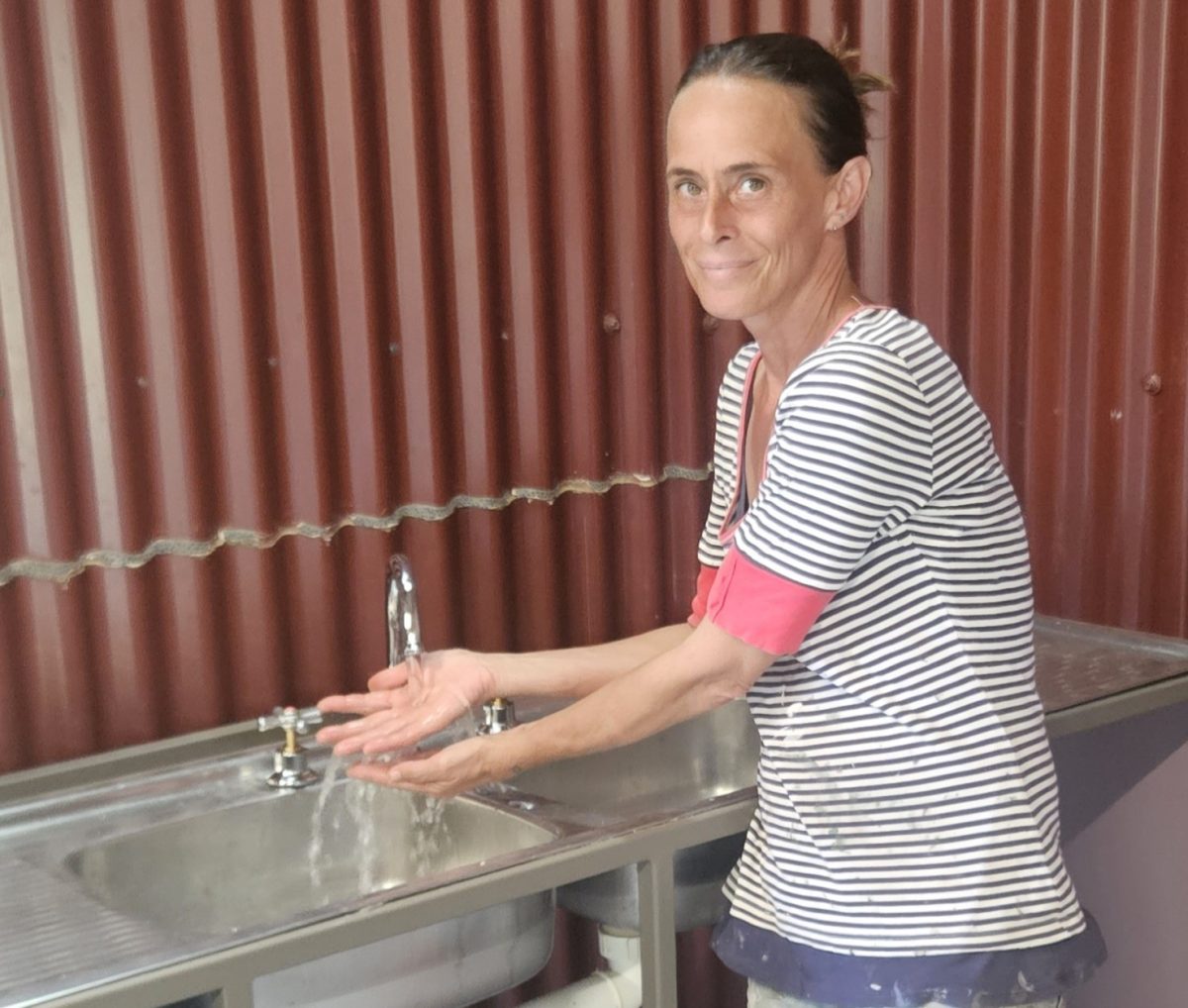 Viola Smith enjoying running water in the house