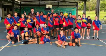 Wet weather fails to dampen AFL Superkick fun in Cooktown