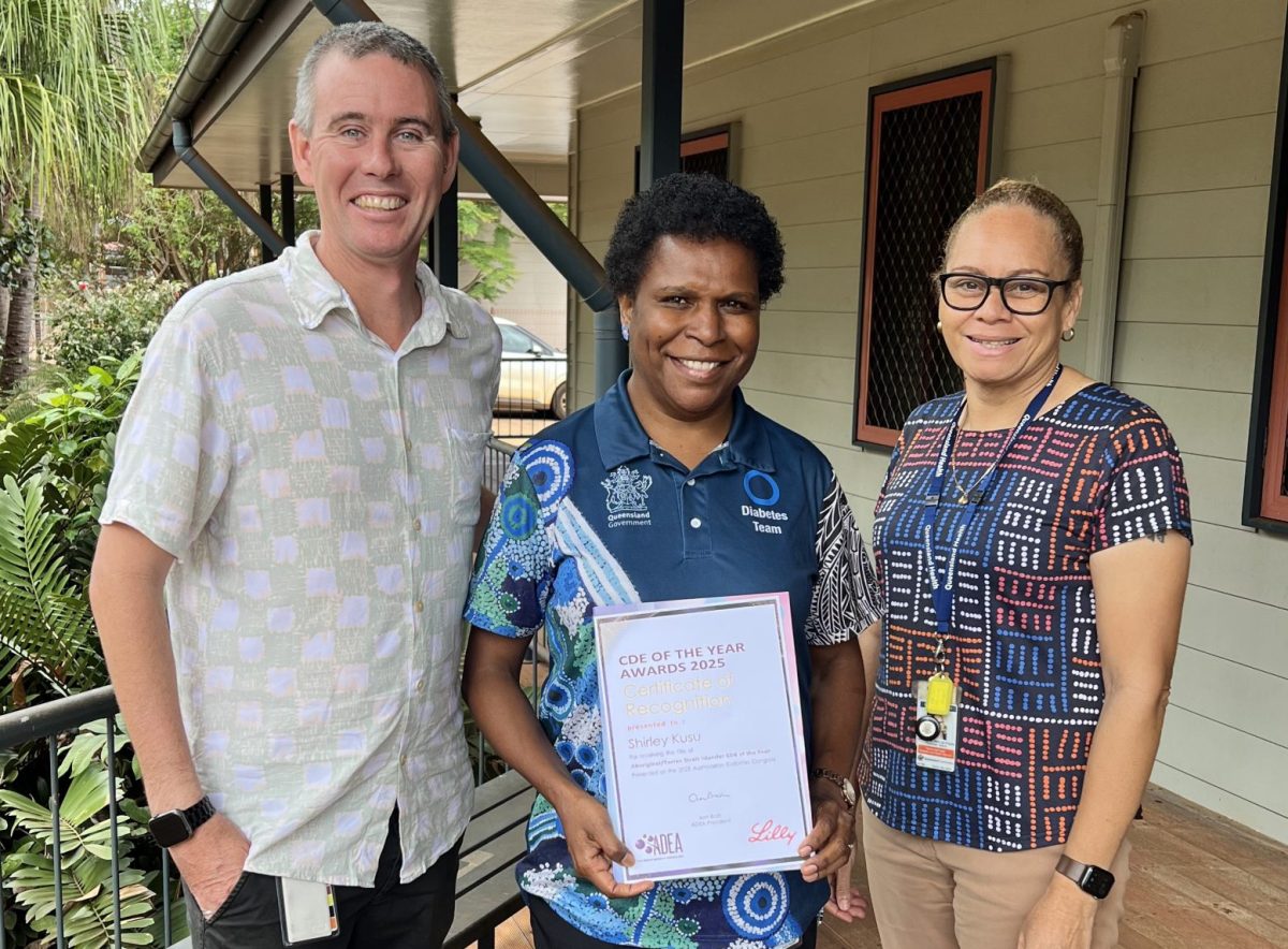 Bamaga clinical nurse consultant Shirley Kusu (centre) is presented with her award for diabetes education by TCHHS director of Nursing Northern Primary Health Care Bernie Feenan and TCHHS director of Primary Health Care Programs Maleta Abednego.