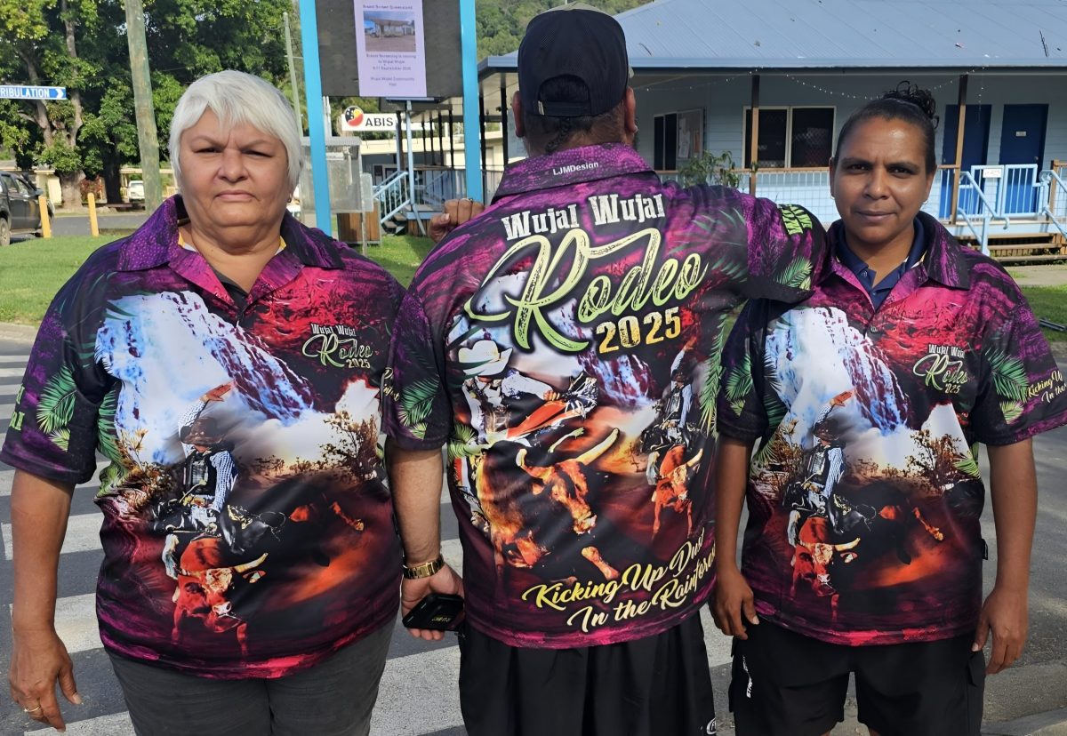 Three people wearing Wujal Wujal Rodeo shirts