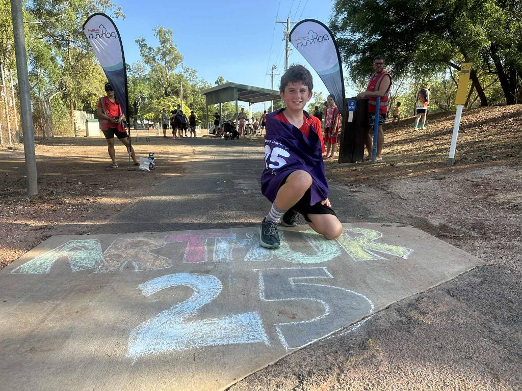 Arthur Campbell with 25 sign.