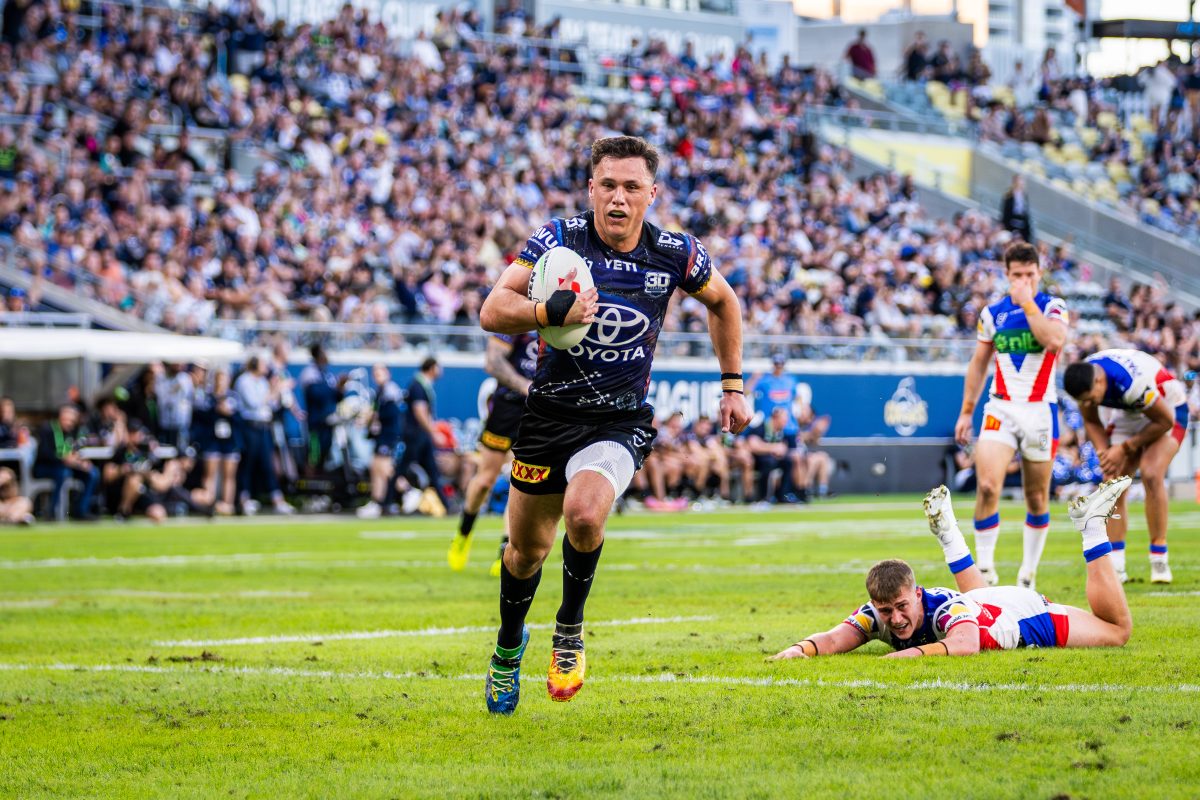 Scott Drinkwater on route to scoring a try for the Cowboys.