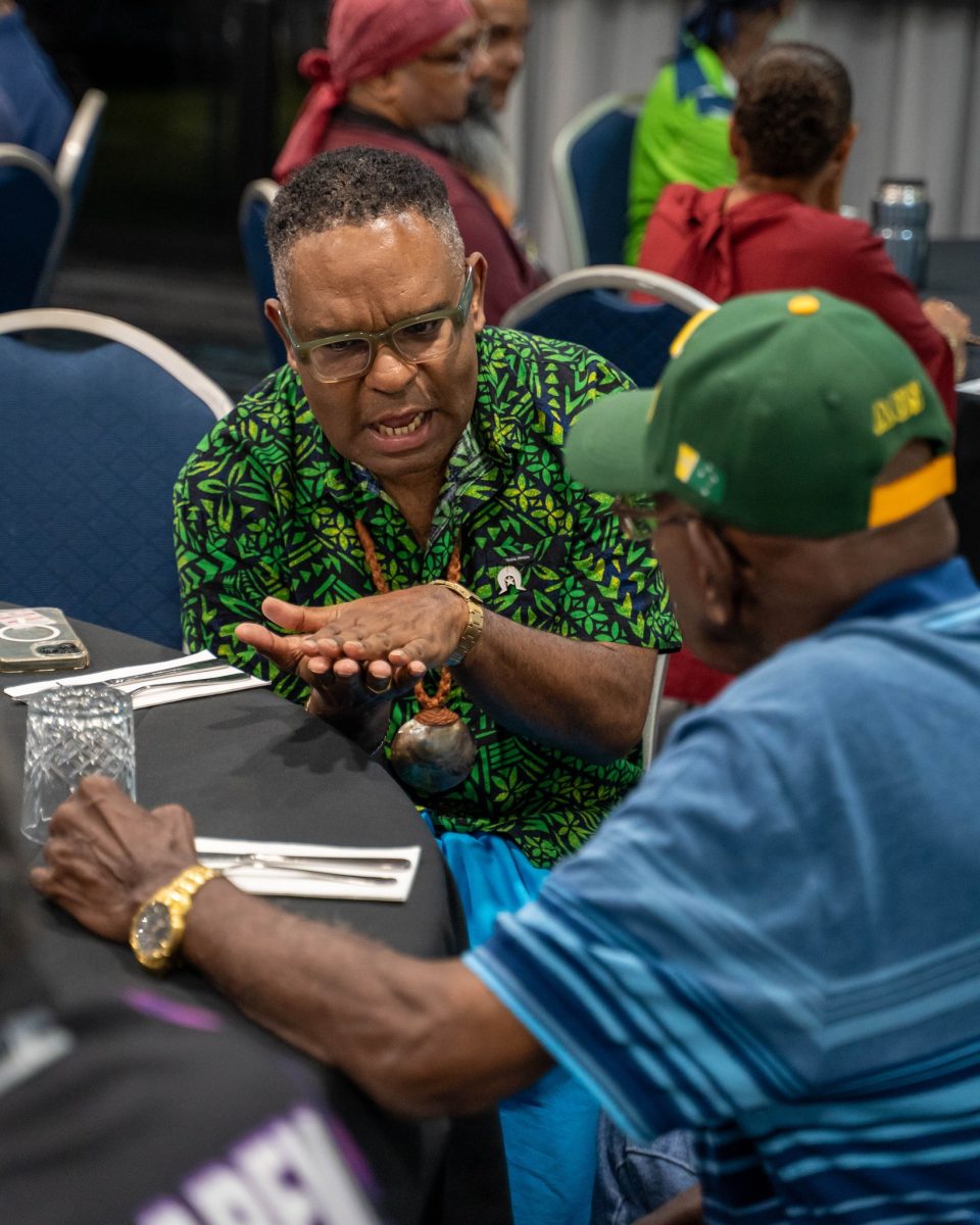 Torres Strait Island Regional Council Mayor Phillemon Mosby engages with attendees at a workshop