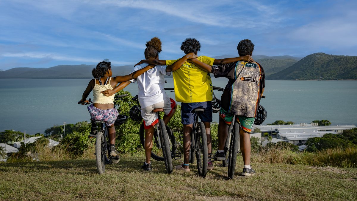 Four Kaziw Meta boarders enjoy the view on Waiben after a long bike ride to Green Hill.