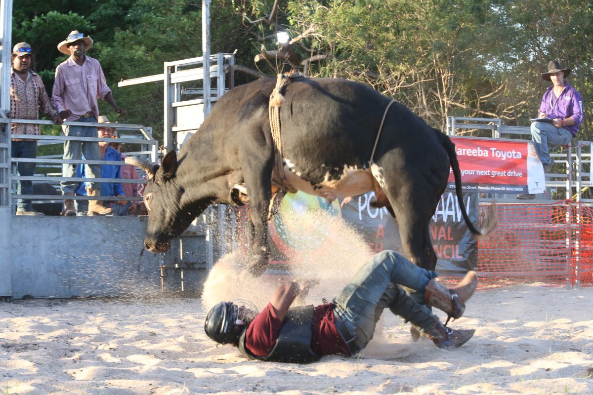 Bull rider tossed at the Pormpuraaw rodeo.