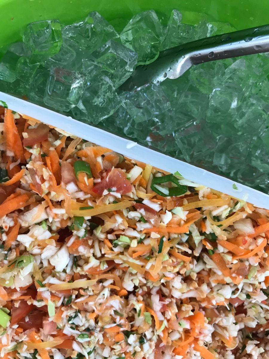 Salad and ice stored in a fridge.