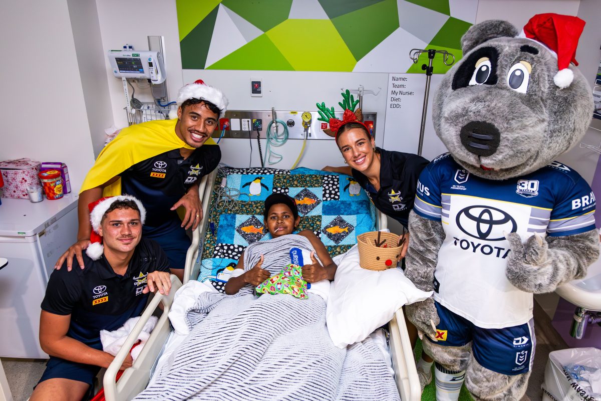 Samuel Nai with NRLW Cowboy Bree Chester, Cowboys in Capes ambassador Murray Taulagi, teammate Mason Barber and club mascot Bluey.