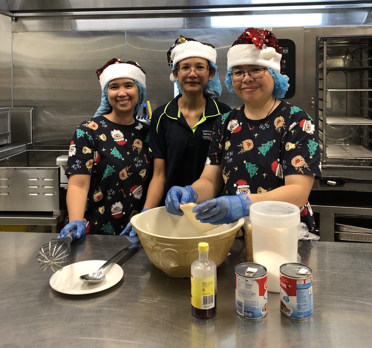Weipa Integrated Health Service kitchen staff Myra Adlawan, Nay Bunkhrong and Rowena Bacay.