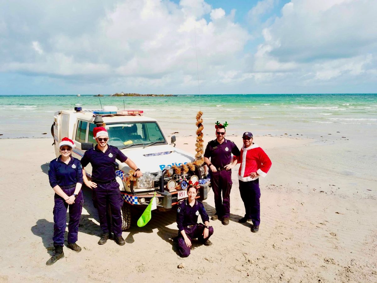 myPolice CapeYork in Christmas outfits on beach.