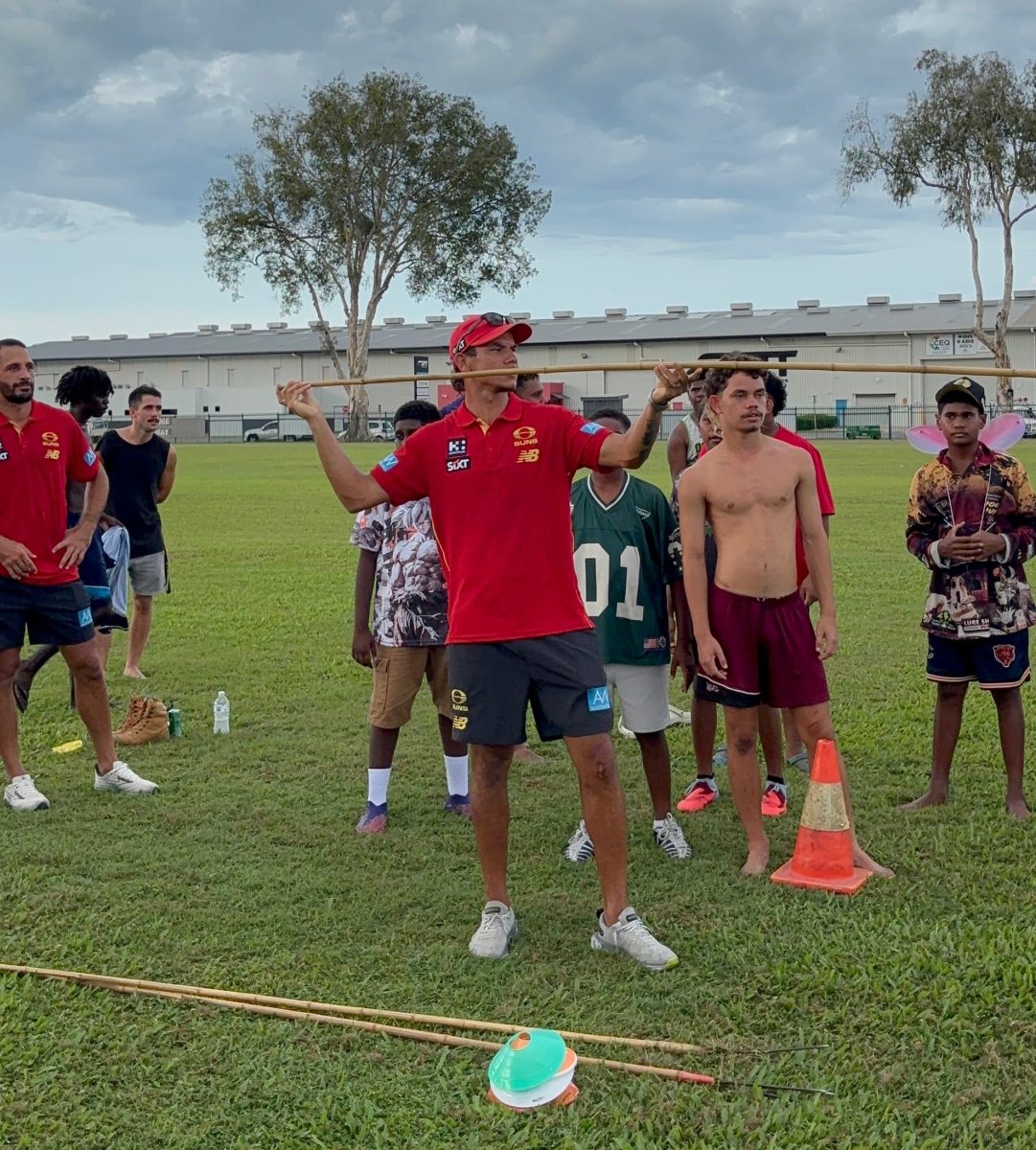 Daniel Rioli tries his hand at spear throwing